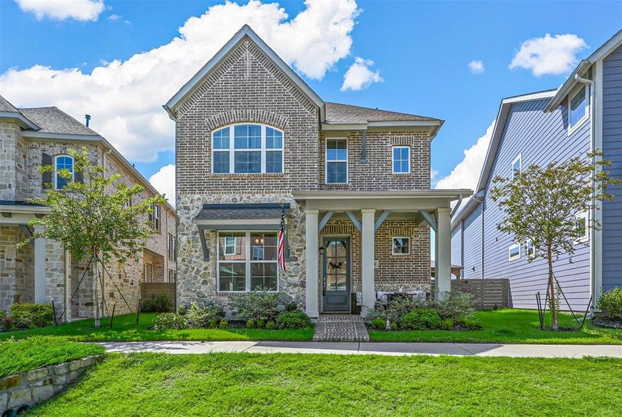 View of front of home featuring a front lawn and brick siding View of front of home featuring a front lawn and brick siding