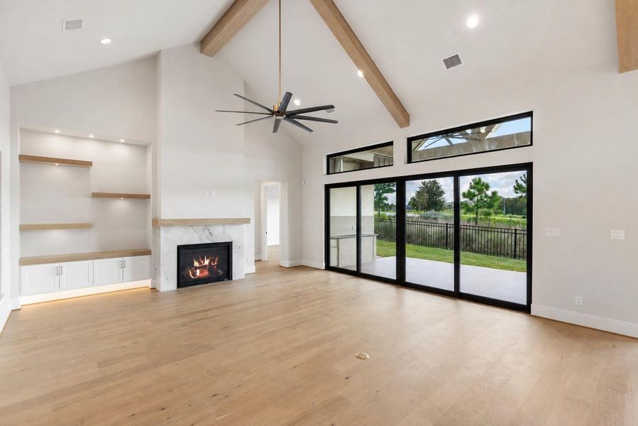 Such an impressive living area w custom lighted display/cabinets next to fireplace Such an impressive living area w custom lighted display/cabinets next to fireplace