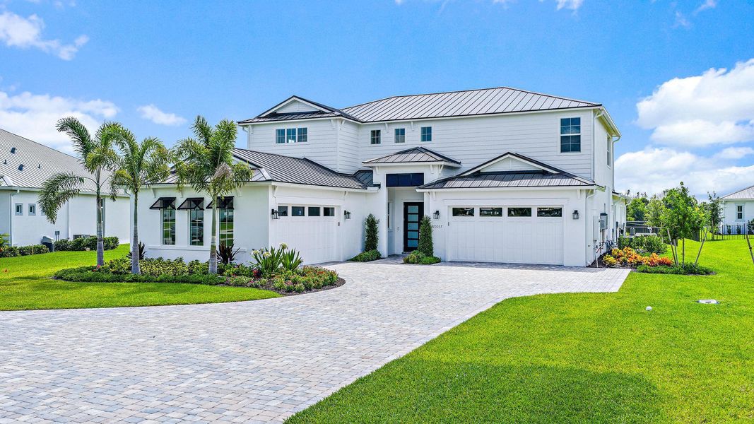 Front exterior of a new home in , Jupiter, FL, highlighting curb appeal (Image 24).