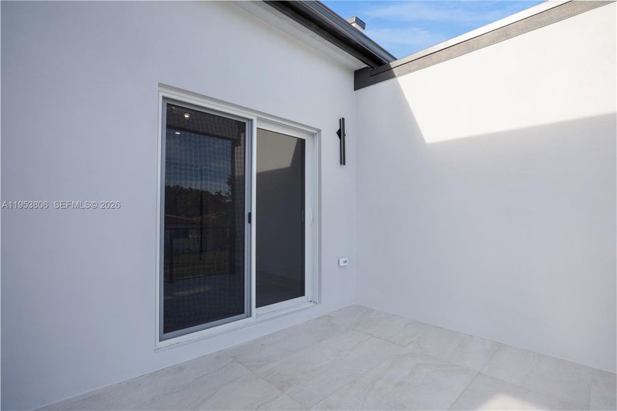 Exterior details and patio area of a home in , Miami (Image 3).