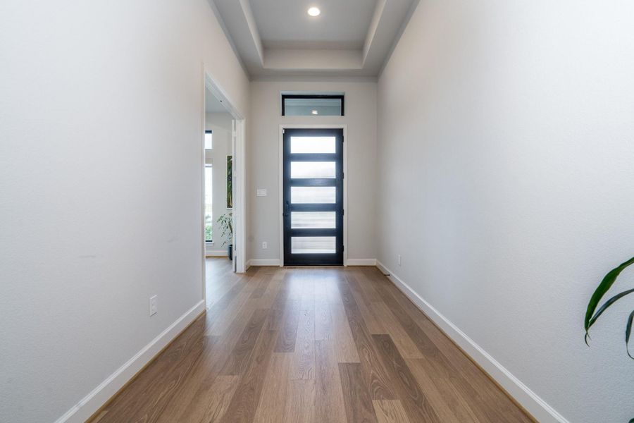One more view down the hallway to your new home! RevWood flooring captures the color, beauty and texture of natural wood, but is fade, scratch and water resistant. It also provides a low maintenance option that is great for children and pets alike. One more view down the hallway to your new home! RevWood flooring captures the color, beauty and texture of natural wood, but is fade, scratch and water resistant. It also provides a low maintenance option that is great for children and pets alike.