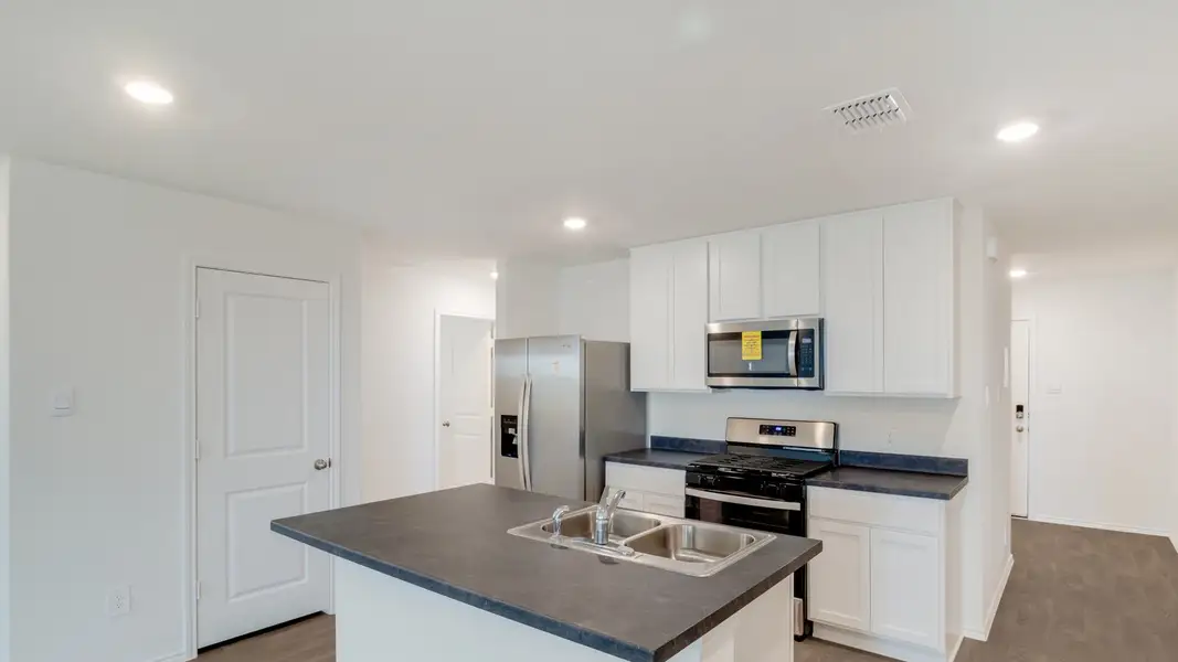 Representative furnished interior of a home built from the The Estero by D.R. Horton in Watermill, Uhland (Image 6).