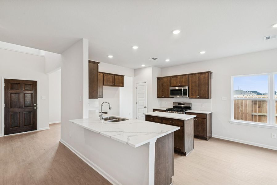 The Georgetown II- Kitchen. Home under construction, photo used for illustrative purposes only, colors and options will vary.