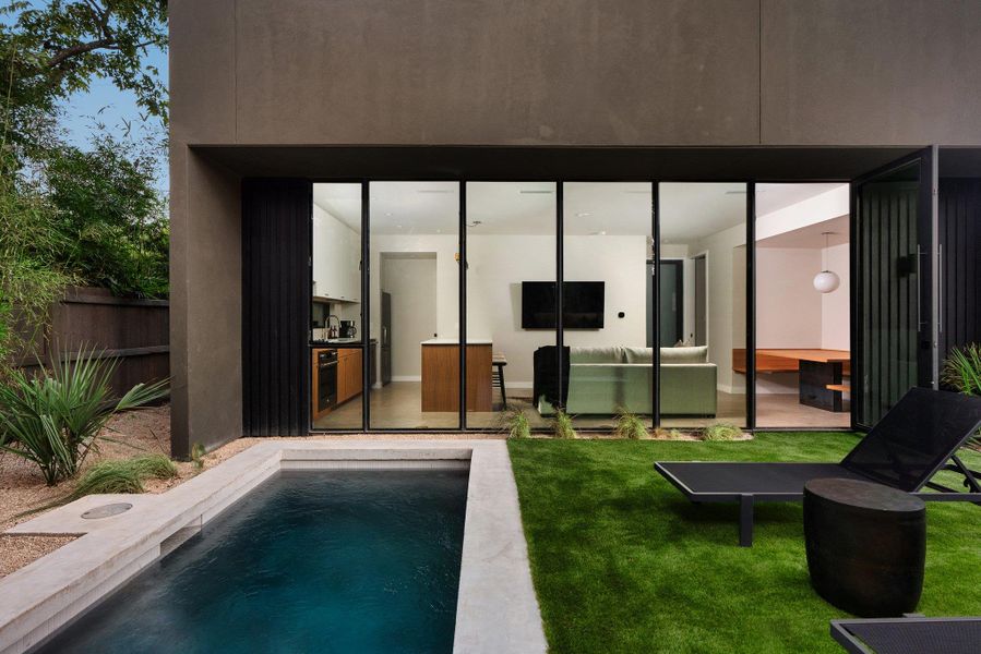 Back of house featuring an outdoor pool, a patio area, and stucco siding Back of house featuring an outdoor pool, a patio area, and stucco siding