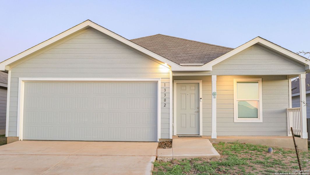 Front exterior of a new home in Mission del Lago, San Antonio, TX, highlighting curb appeal (Image 1). Front exterior of a new home in Mission del Lago, San Antonio, TX, highlighting curb appeal (Image 1).