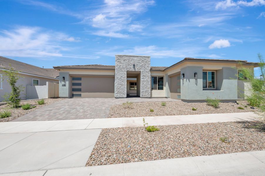 Front exterior of a new home in Blossom Rock, Apache Junction, AZ, highlighting curb appeal (Image 23). Front exterior of a new home in Blossom Rock, Apache Junction, AZ, highlighting curb appeal (Image 23).