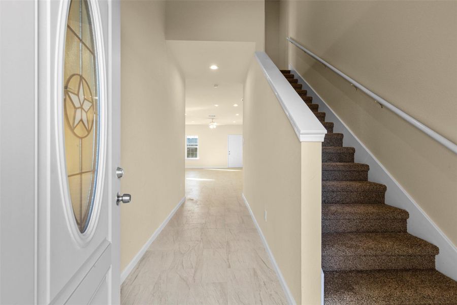 This aerial view shows a residential neighborhood with a mix of single-family homes and greenery. The highlighted property is near a street corner, surrounded by other homes and some open spaces. The area appears to be suburban with a blend of older and newer houses. This aerial view shows a residential neighborhood with a mix of single-family homes and greenery. The highlighted property is near a street corner, surrounded by other homes and some open spaces. The area appears to be suburban with a blend of older and newer houses.