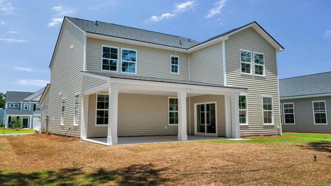 Exterior details and patio area of a home in Creekside at Andrews, Summerville (Image 2). Exterior details and patio area of a home in Creekside at Andrews, Summerville (Image 2).