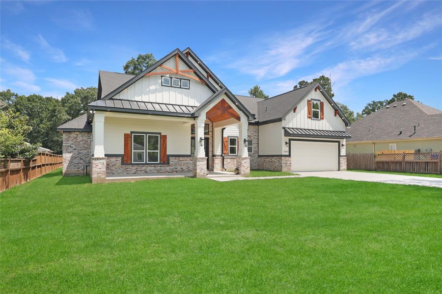 This home features attention to details on the exterior from oversized front entry and porch to the wood accents, and lighting that really showcases this home's exterior at night.