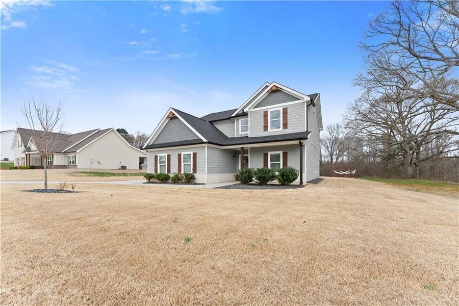 Front exterior of a new home in , Jefferson, GA, highlighting curb appeal (Image 20).