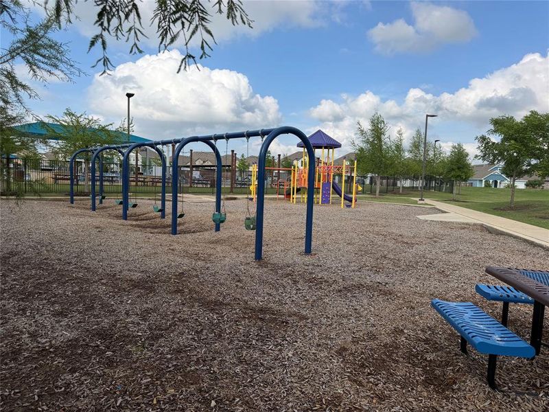 Playground Between Sand Volleyball Court and Pool