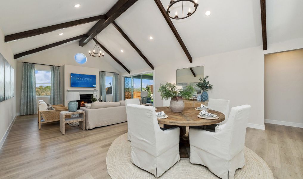 Cozy dining area with chandelier and great room with gorgeous floors