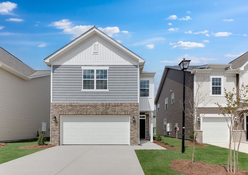 Front exterior of a new home in Taylor Hill, Gilbert, SC, highlighting curb appeal (Image 1). Front exterior of a new home in Taylor Hill, Gilbert, SC, highlighting curb appeal (Image 1).