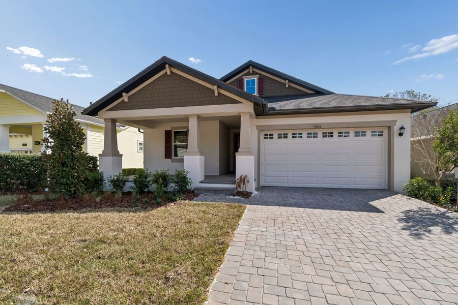 Representative exterior photo of a completed home built from the Juno by William Ryan Homes in Southern Hills Plantation, Brooksville, FL (Image 26). Representative exterior photo of a completed home built from the Juno by William Ryan Homes in Southern Hills Plantation, Brooksville, FL (Image 26).