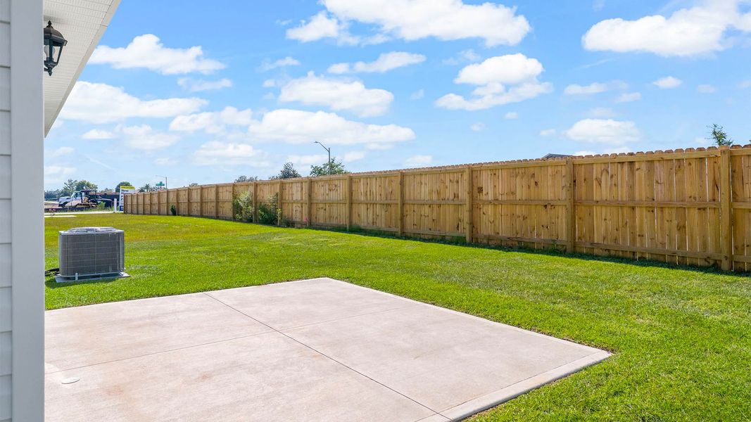 Front exterior of a new home in Park Place, Panama City, FL, highlighting curb appeal (Image 18). Front exterior of a new home in Park Place, Panama City, FL, highlighting curb appeal (Image 18).