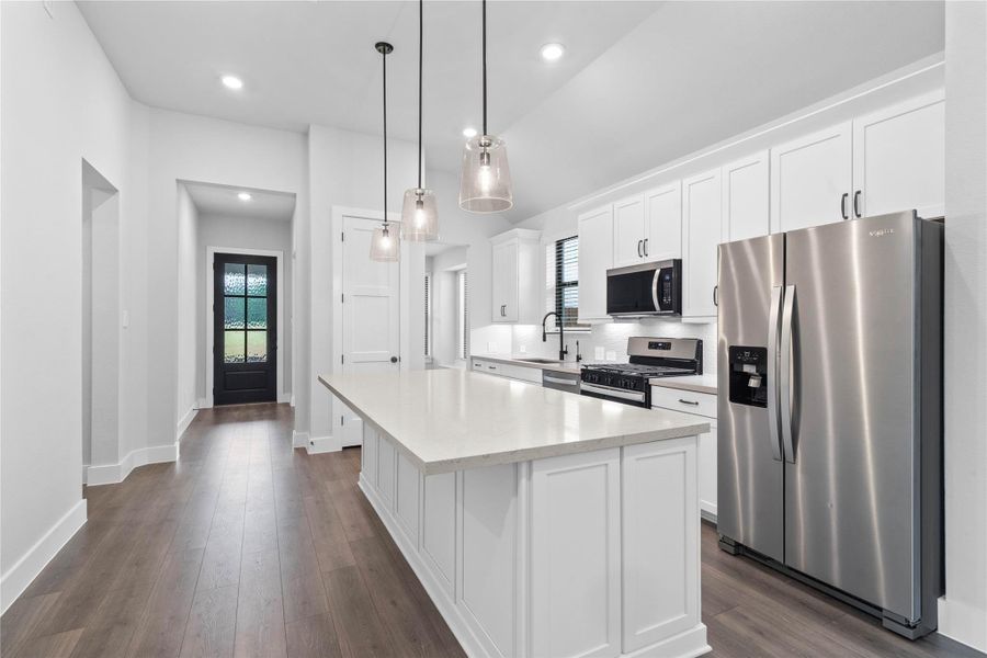 Greet your guests at the beautiful front entry door, which opens into a wide, dramatic hallway leading straight to the heart of the kitchen. Greet your guests at the beautiful front entry door, which opens into a wide, dramatic hallway leading straight to the heart of the kitchen.