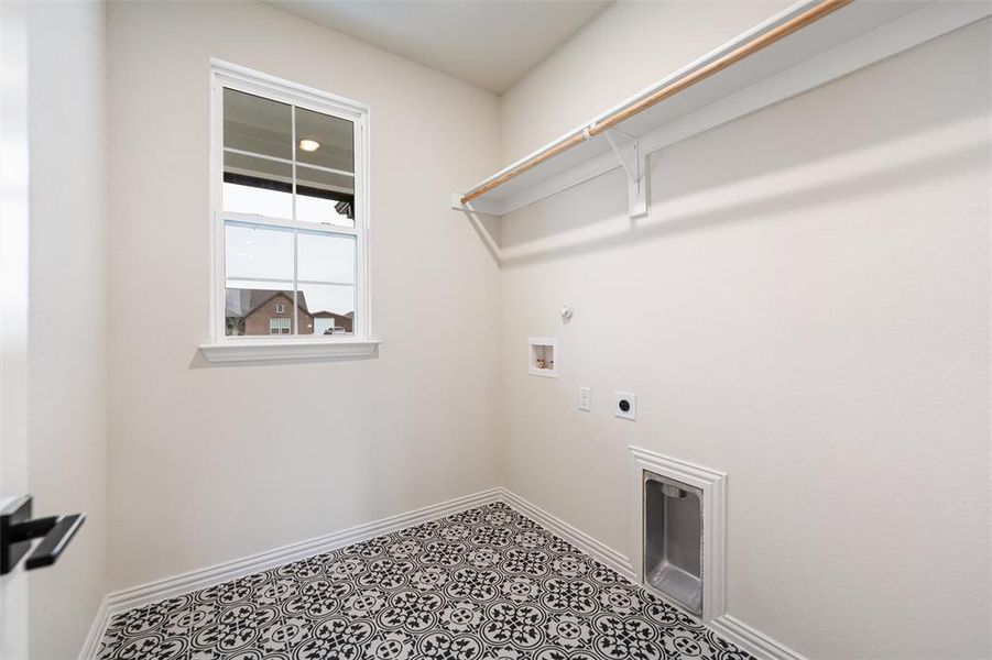 Laundry room with hookup for a gas dryer, hookup for an electric dryer, and washer hookup