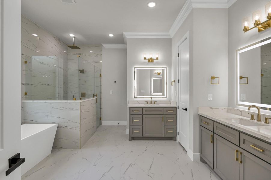 Step into your spa like en-suite primary bathroom with designer tile and quartz countertops. Step into your spa like en-suite primary bathroom with designer tile and quartz countertops.