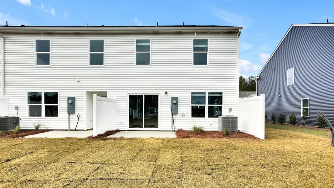 Exterior details and patio area of a home in Grayson Park Townhomes, Leland (Image 3). Exterior details and patio area of a home in Grayson Park Townhomes, Leland (Image 3).