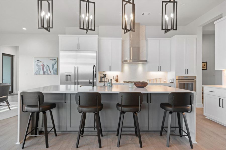 The main level is thoughtfully curated for both grand entertaining and everyday living, featuring a private study, an expansive great room, formal dining area, and a chef-inspired kitchen outfitted with premium luxury appliances, a walk-in pantry, and an oversized center island ideal for gathering.