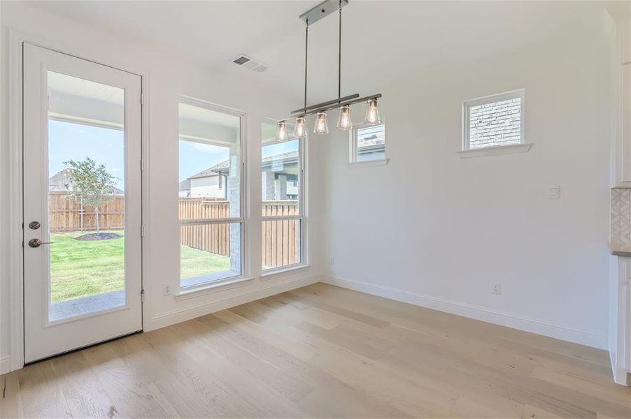 Unfurnished dining area with light hardwood / wood-style floors