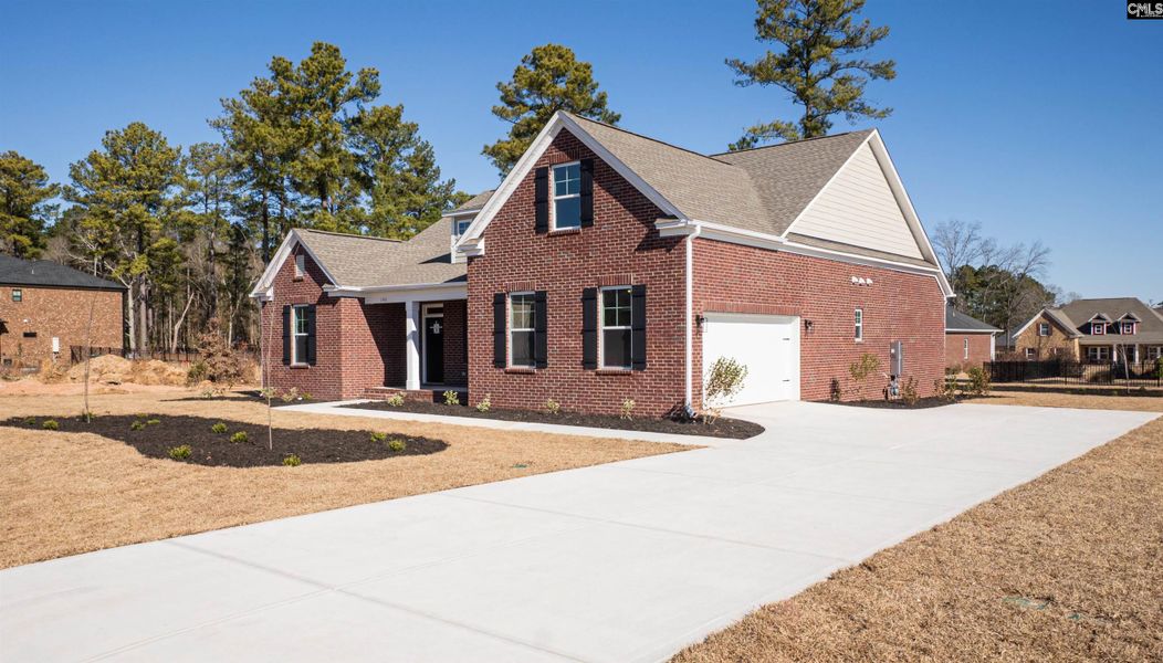 Front exterior of a new home in The Cove, Sumter, SC, highlighting curb appeal (Image 22). Front exterior of a new home in The Cove, Sumter, SC, highlighting curb appeal (Image 22).