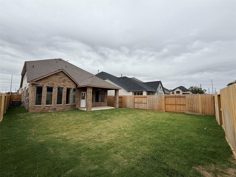 Exterior details and patio area of a home in Candela 40', Richmond (Image 3).