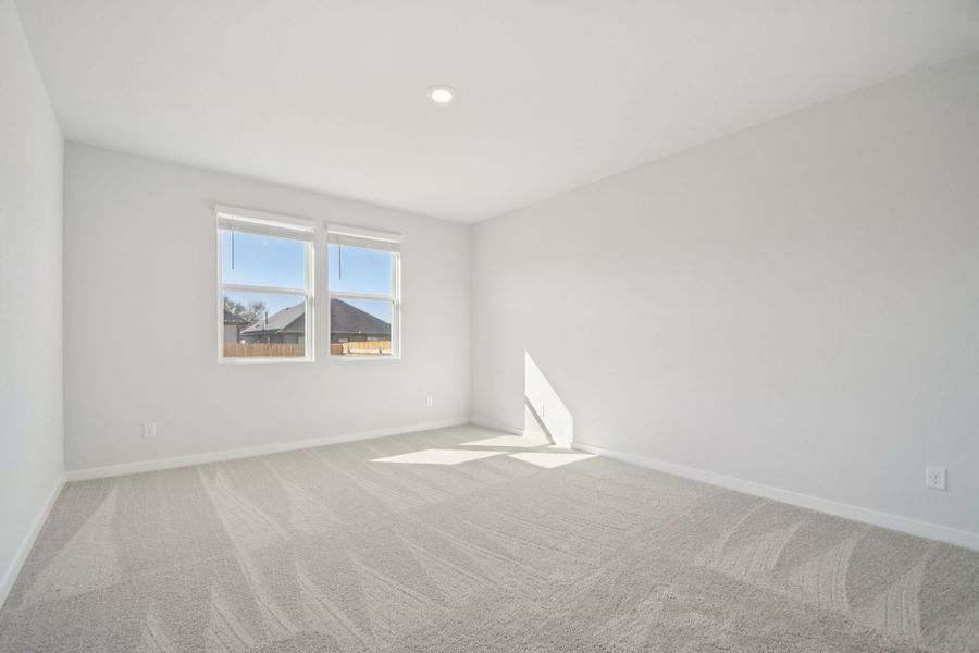 A room with a bed and a window.