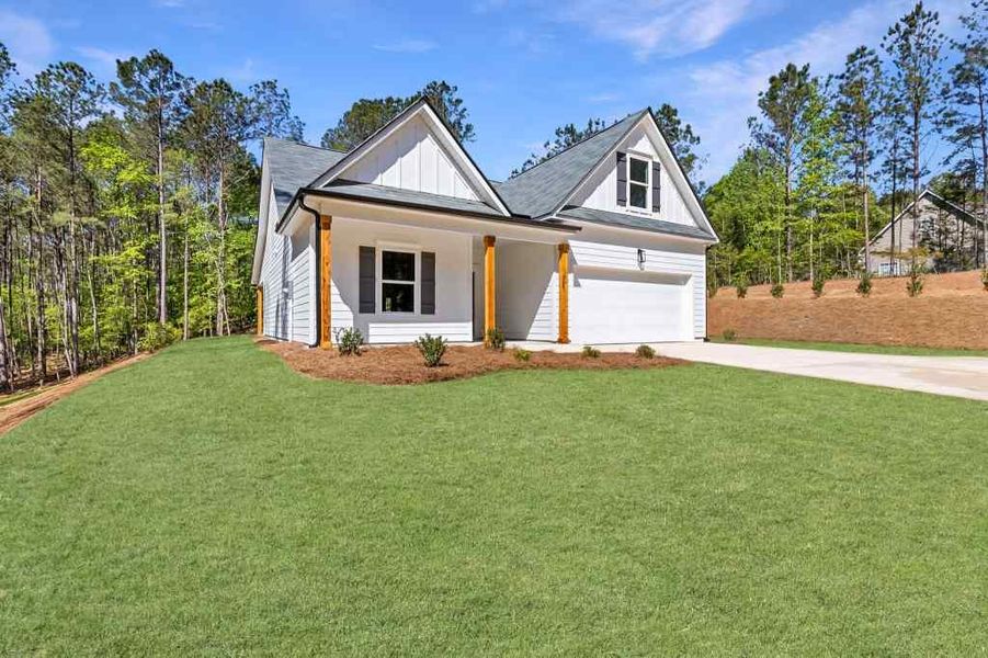 Front exterior of a new home in , Covington, GA, highlighting curb appeal (Image 17).