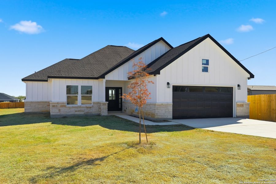 Front exterior of a new home in , Atascosa, TX, highlighting curb appeal (Image 1).
