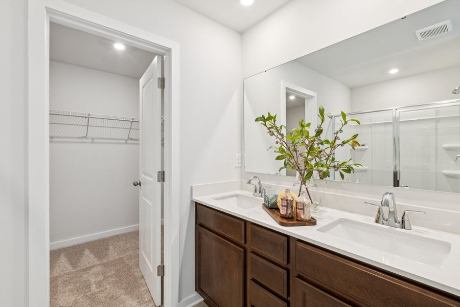 A bathroom with a large mirror. A bathroom with a large mirror.