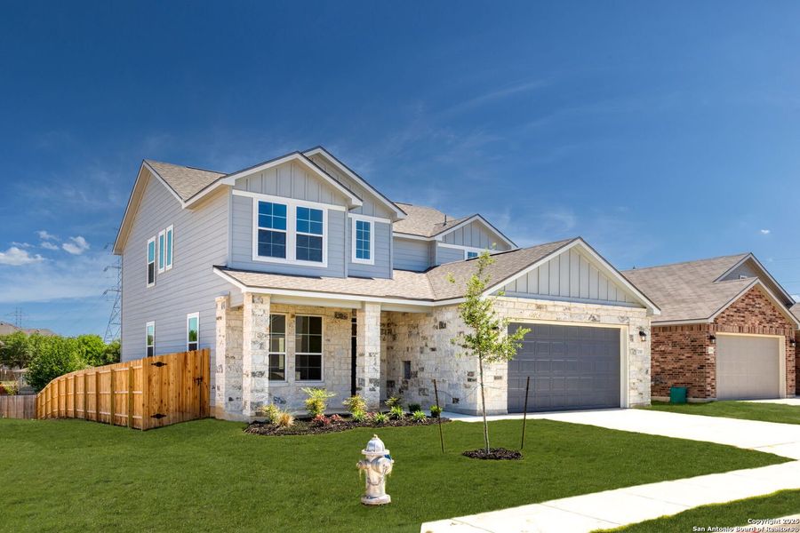 Front exterior of a new home in Skybrooke, Live Oak, TX, highlighting curb appeal (Image 1).