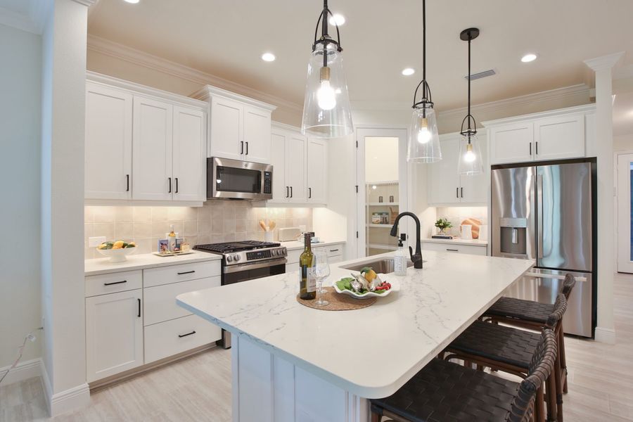 Representative furnished interior of a home built from the Tidewinds 2 by Neal Communities in Boca Royale Golf & Country Club at Wellen Park, Englewood (Image 7).