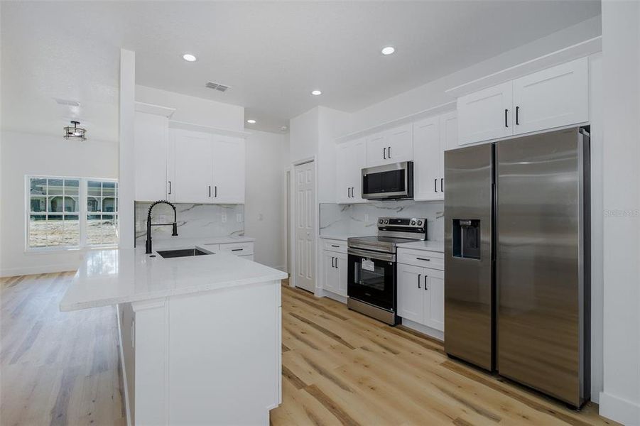 Furnished interior view inside a new home in , Weeki Wachee (Image 18).