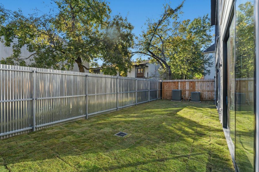Deep backyard with divider fence to be installed.