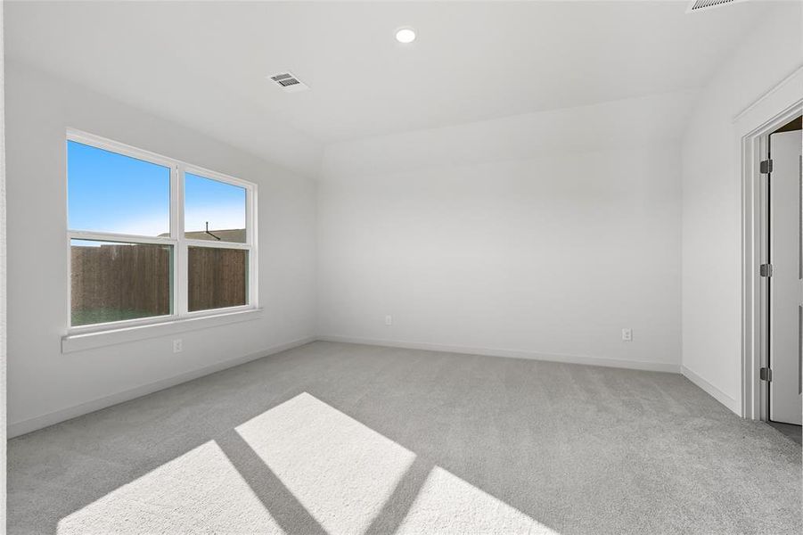 Unfurnished room featuring light carpet and recessed lighting Unfurnished room featuring light carpet and recessed lighting