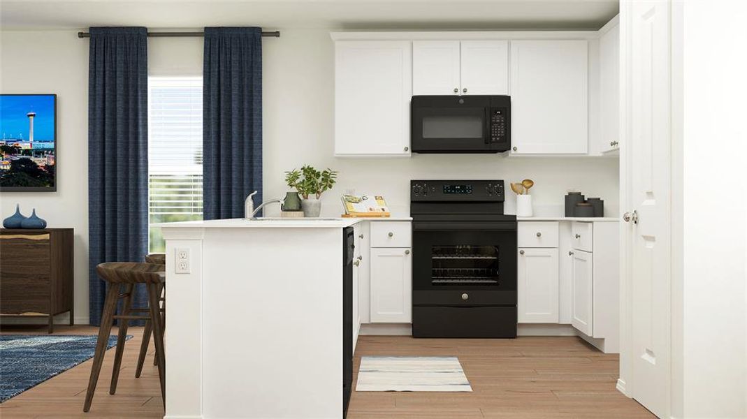 Kitchen with kitchen peninsula, black appliances, light hardwood / wood-style flooring, white cabinets, and a breakfast bar area