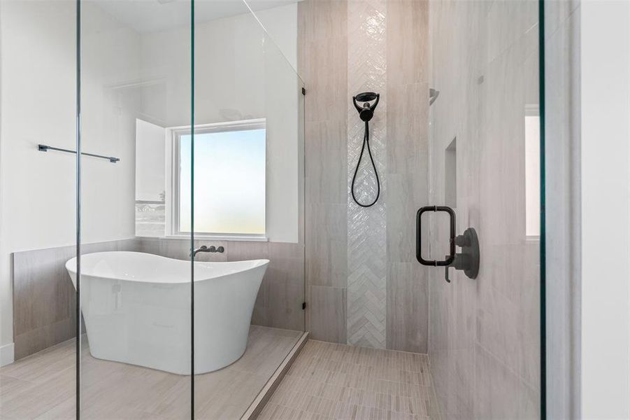Full bath featuring walk in shower, a soaking tub, tile patterned floors, and tile walls
