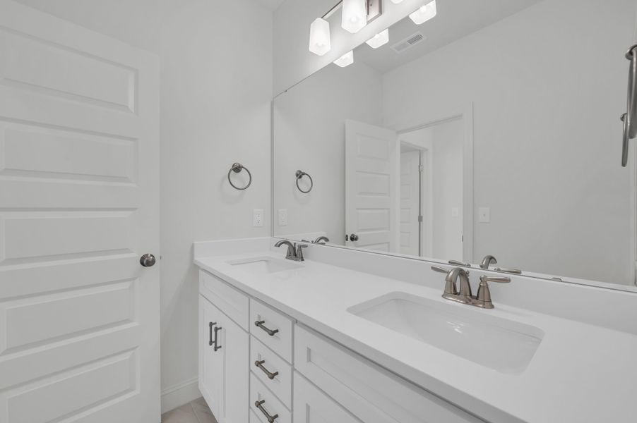 Representative furnished interior of a home built from the The Hampton by RobuckHomes in Windwater, Hampstead (Image 18).