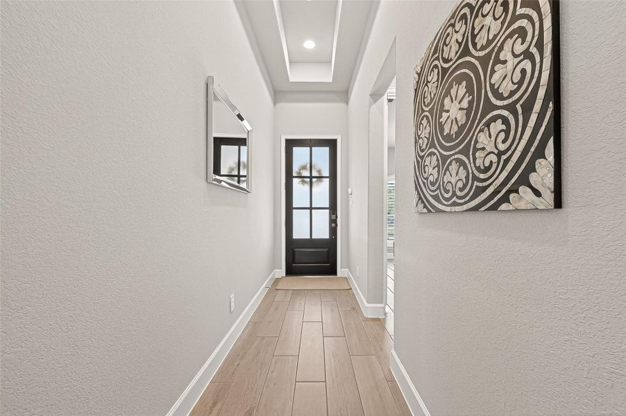 Beautiful entryway with high ceilings for an open, spacious feel. (Note: Photo is staged; property is currently vacant.) Beautiful entryway with high ceilings for an open, spacious feel. (Note: Photo is staged; property is currently vacant.)
