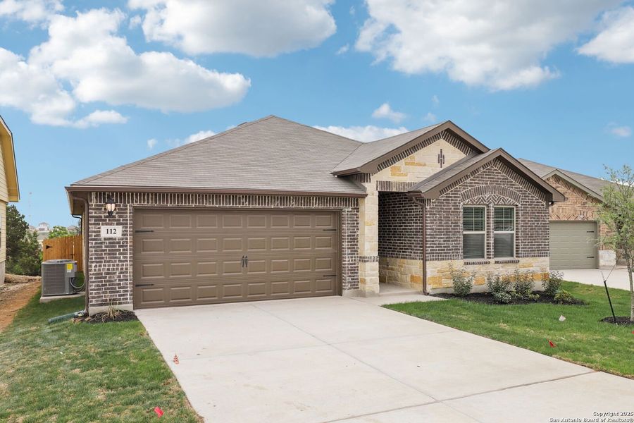 Front exterior of a new home in , Cibolo, TX, highlighting curb appeal (Image 25).