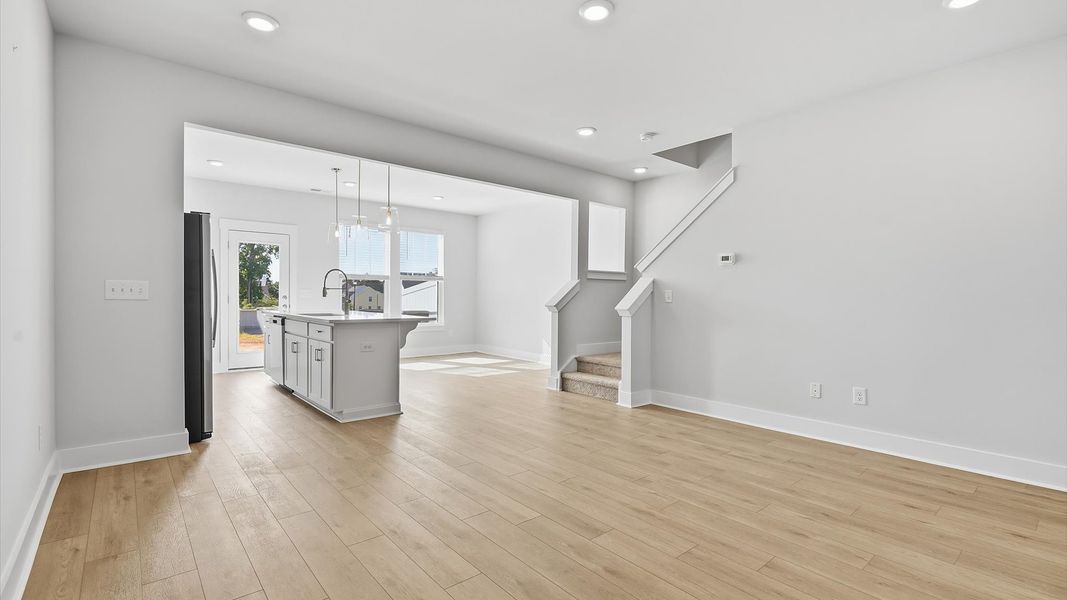 Exceptional family space with hardwood floors and seamless flow to dining and kitchen areas near Downtown Simpsonville