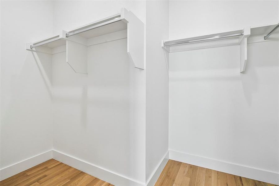 Walk in closet featuring hardwood floors