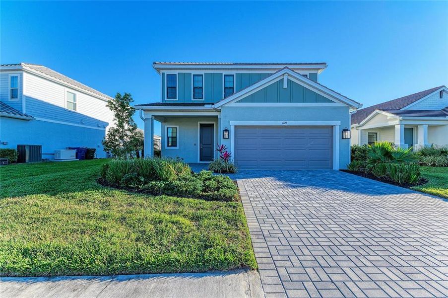 Front exterior of a new home in , Sarasota, FL, highlighting curb appeal (Image 23).