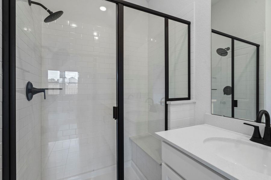 This additional view of your primary bathroom features tile flooring, fresh paint, large walk-in shower, and a large walk-in closet. This additional view of your primary bathroom features tile flooring, fresh paint, large walk-in shower, and a large walk-in closet.