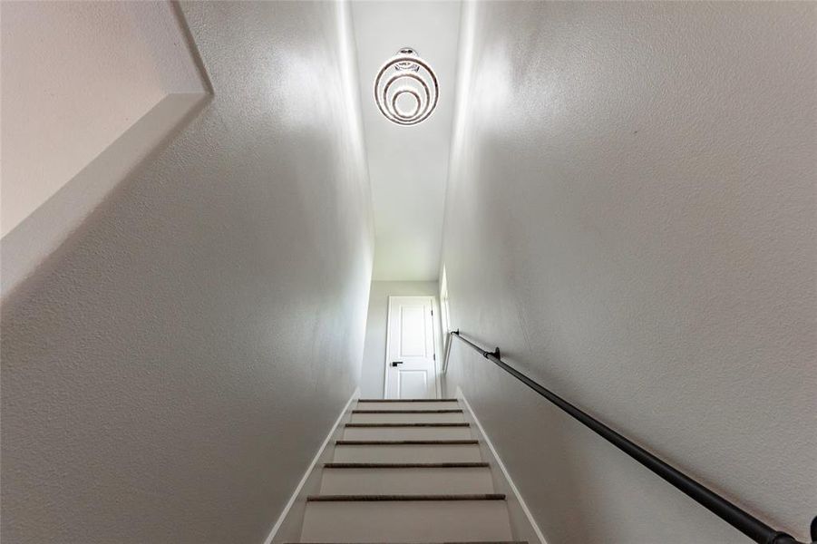 The light provided by the stunning chandelier along with the natural lighting will guide you upstairs