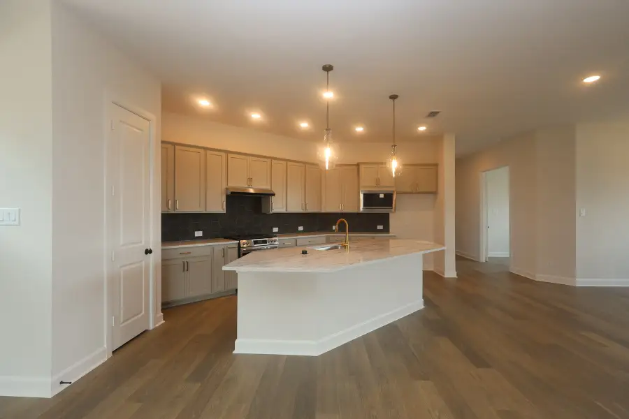 Furnished interior view inside a new home in Riceland - Enclave Row Collection, Mont Belvieu (Image 6).