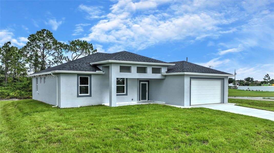 Front exterior of a new home in , Lehigh Acres, FL, highlighting curb appeal (Image 1). Front exterior of a new home in , Lehigh Acres, FL, highlighting curb appeal (Image 1).