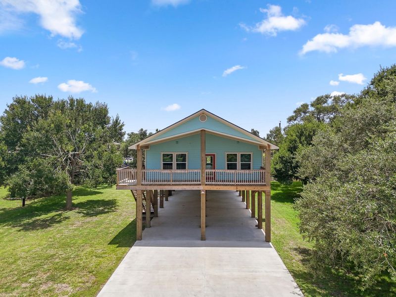 Front exterior of a new home in , Sargent, TX, highlighting curb appeal (Image 23). Front exterior of a new home in , Sargent, TX, highlighting curb appeal (Image 23).