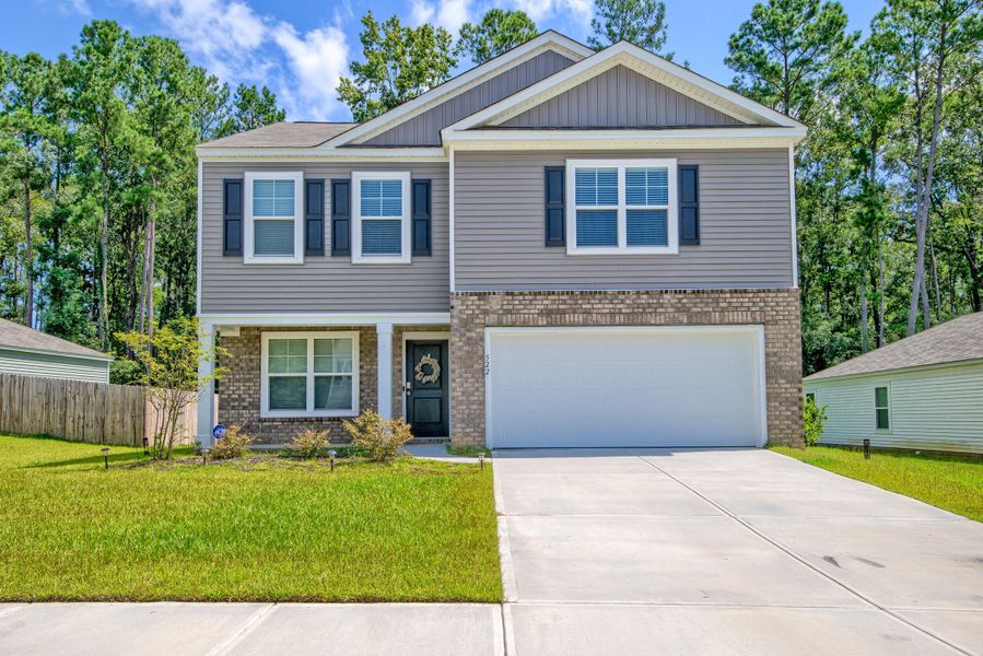 Front exterior of a new home in Stone Ridge, Moncks Corner, SC, highlighting curb appeal (Image 26).